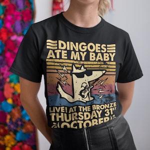 Camiseta, sudadera y sudadera vintage con el lema "Los dingos se comieron a mi bebé"