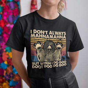 May include: Black t-shirt with a vintage-style graphic featuring three furry puppets with the text "I don't always Mahna Mahna, but when I do doo doo doo doo doo."