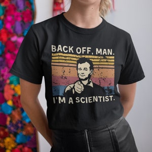 May include: Black t-shirt with a vintage-style graphic of Bill Murray pointing and the text "Back off, man. I'm a scientist."