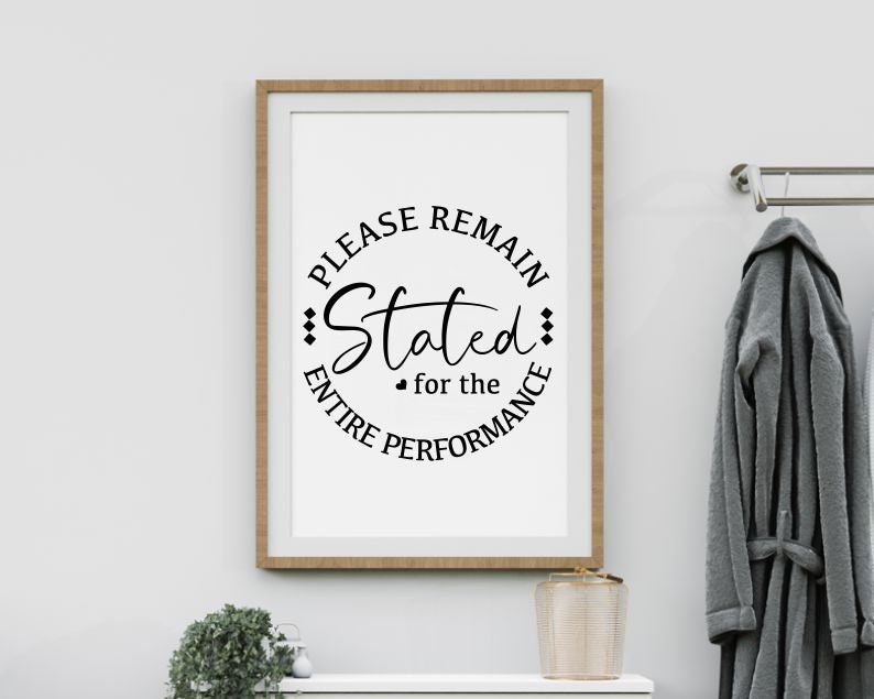 May include: A framed print with a black and white design that says "Please remain seated for the entire performance".