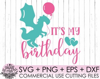 May include: It's My Birthday text with a teal dragon and pink balloon and hearts.  The design is perfect for a birthday party or celebration.