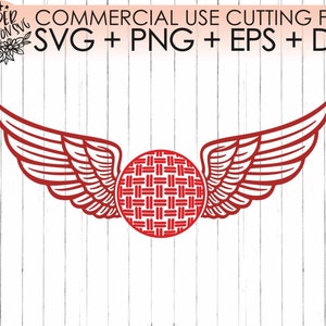 May include: Red winged design with a red and white patterned circle in the center. The design is on a white wood background.