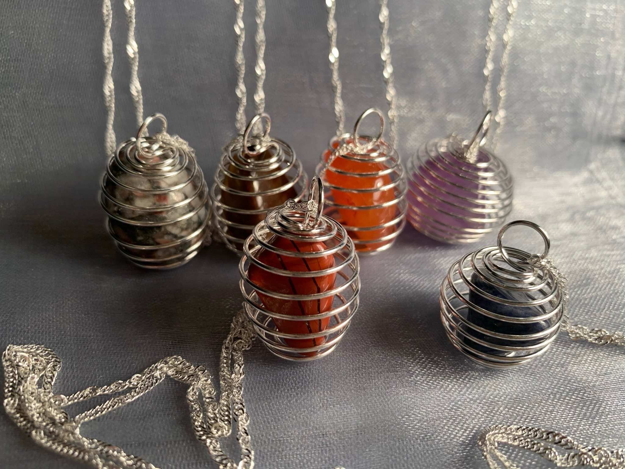 Natural Crystals in spiral cage with silver plated 24" chain