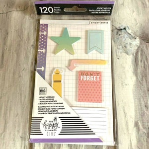 May include: A pack of 120 colorful sticky notes with different shapes and designs. The notes include a star, a water bottle, a banner, and a note that says "Don't Forget". The pack is labeled "The Happy Planner Girl" and includes the text "Sticky Notes, Papillons Adhesifs, Notas Adhesivas".