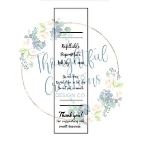 May include: A white background with a floral wreath design in blue, cream, and green. The text reads "Thoughtful Creations Design Co." and includes the words "Refillable Papermate Ink Joy 7 mm." Additional text says "Thank you! For supporting my small business."