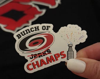 Carolina Hurricanes ""Bunch of Jerks/CHAMPS"" Logo Aufkleber."