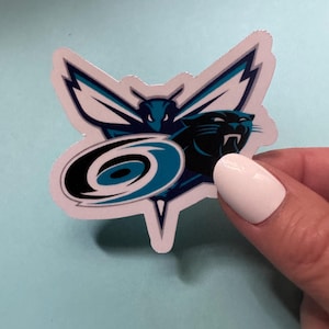 May include: A white sticker featuring a blue and black graphic of a panther and a stylised hornet. The panther is in the foreground and the hornet is in the background. The hornet has wings shaped like lightning bolts. The panther is facing left and has its mouth open. The hornet is facing right and has its wings spread out. The sticker is on a light blue background.