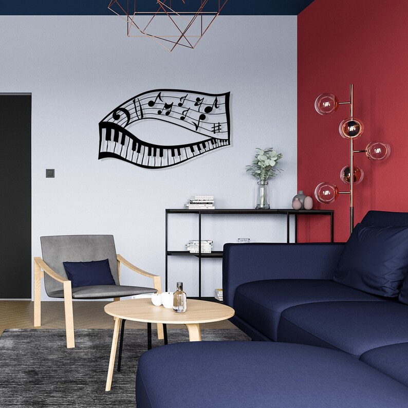 May include: A living room interior with a blue sofa, a gray armchair, a wooden coffee table, and a black metal shelf unit. A black metal wall sculpture of musical notes and a piano keyboard is on the wall. A floor lamp with glass globes is in the corner.