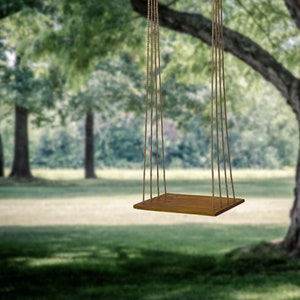 Outdoor adult and kids swing. Minimalist rustic design. Country rustic wedding centerpiece