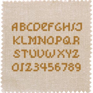 May include: A beige fabric swatch with a brown pixelated alphabet and numbers printed on it. The letters are A-Z and the numbers are 0-9.