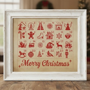 Op de afbeelding: Een ingelijste kerst adventskalender met rode kruissteekontwerpen op een beige achtergrond. De kalender heeft 24 genummerde vierkanten met feestelijke afbeeldingen zoals een sneeuwvlok, engel en rendier. De woorden "Merry Christmas" zijn onderaan gestikt.