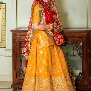Saundaryam Fashions| Upada Silk Wedding sangeet Rajputi Poshak in yellow and Red combination with zari work