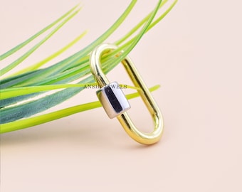 May include: Gold oval-shaped lobster clasp with a silver-toned barrel. ANSH JEWELS is printed on the barrel.