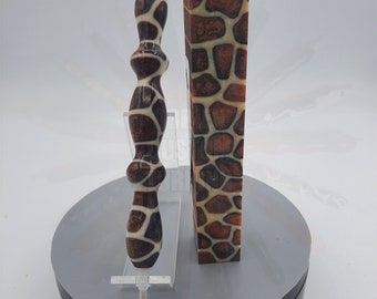 May include: Two brown and white patterned wooden blanks, one is a pen blank and the other is a larger block. The patterns resemble a giraffe print.