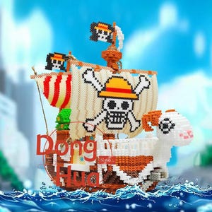 May include: A colourful, pixelated model of a pirate ship with a skull and crossbones on the sail. The ship has a white and orange ram head at the front. The text "Dong Hua" is visible on the ship's hull.
