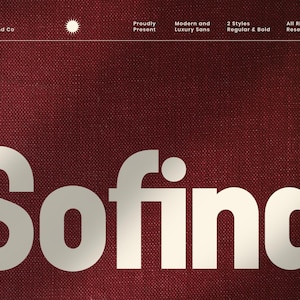 May include: White "Sofina" text on a burgundy background. The text is in a bold, sans-serif font. Above the text are smaller white words and symbols, including "Created by Flawless And Co" and "All Rights Reserved 2025".
