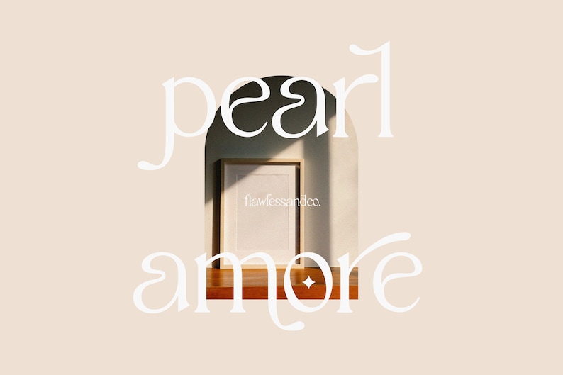May include: White text on a beige background reads "pearl amore" with a decorative archway in the middle. Inside the archway is a wooden frame with a white mat and a blank white paper inside. The text "flawlessandco." is printed in the bottom right corner of the paper.