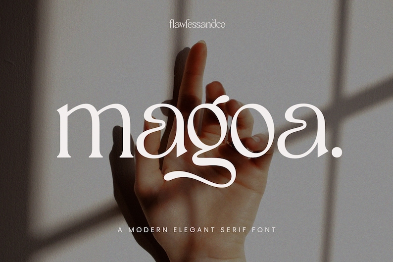 May include: A modern elegant serif font called "magoa." The font is white and is displayed against a light gray background with shadows.