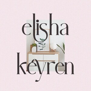 May include: A white dresser with four drawers and a light wood top. The dresser has a plant, a framed print, and a lamp on top. The text "elisha keyren" is in black font on a pink background.