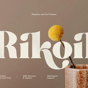May include: A serif font design with the word "Rikoil" in large, off-white letters. The image includes a yellow flower in a decorative vase and text that reads "Flawless and Co Present". Additional text describes the font's features.