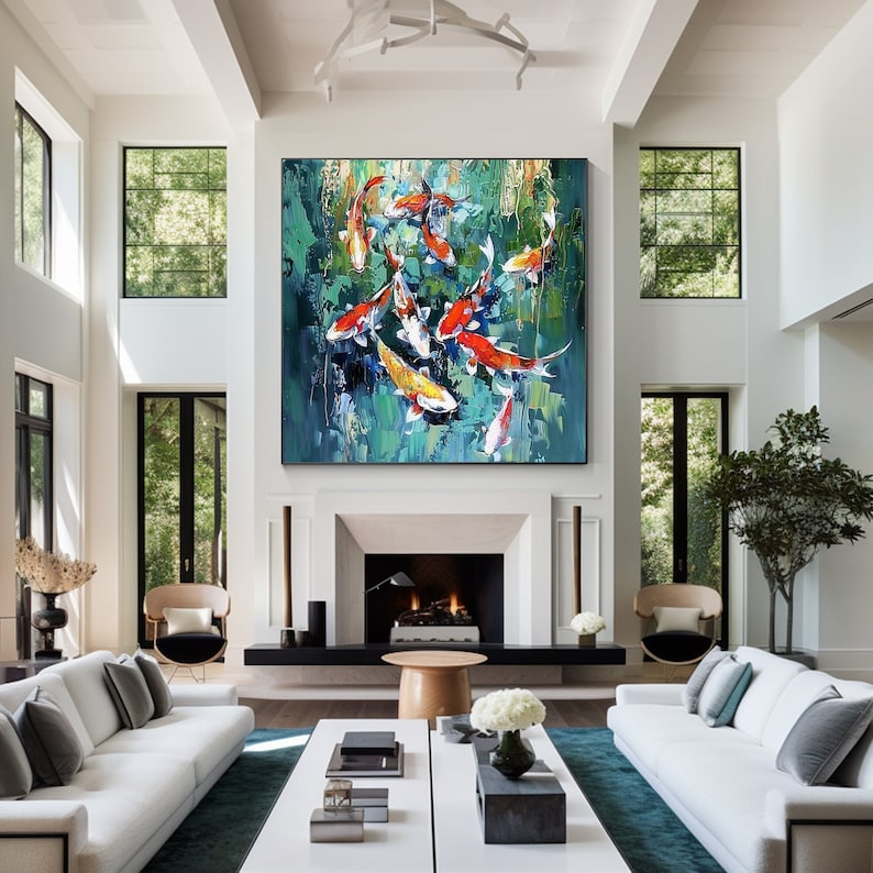 May include: Large abstract painting of koi fish in a pond. The artwork features vibrant orange, yellow, and white fish against a textured teal and green background. The painting is displayed in a modern living room with white walls and furniture.