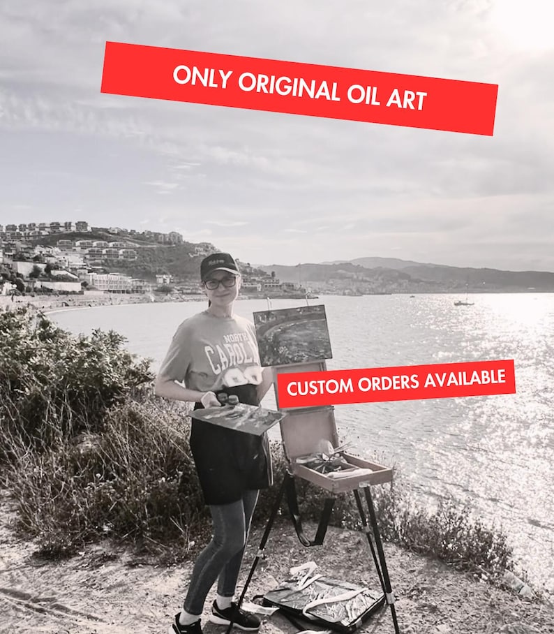May include: Black and white image of an artist painting outdoors by the sea. The artist is holding a canvas and standing next to an easel. Text on the image reads "ONLY ORIGINAL OIL ART" and "CUSTOM ORDERS AVAILABLE".