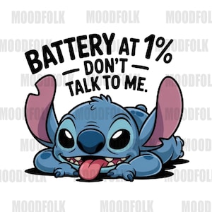 May include: A cartoon illustration of a blue alien-like creature with large ears and a long tongue. The text "BATTERY AT 1% - DON'T - TALK TO ME" is above the character. The character is lying down.
