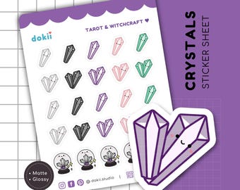 May include: A sticker sheet with a variety of cute crystal designs. The sheet includes crystals in different colors, including purple, pink, green, and gray. The sheet also includes a crystal ball with a cute face. The text on the sheet reads "Tarot & Witchcraft" and "Crystals Sticker Sheet".