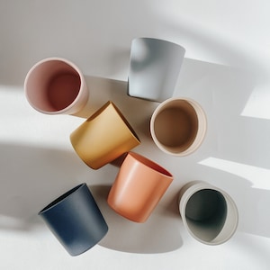 Gobelet de sevrage en silicone Nomu : pot à collation pour tout-petit, sans BPA