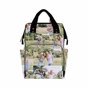 May include: A beige diaper bag with black straps and gold zippers. The bag is covered in a collage of photos of a family in a field.