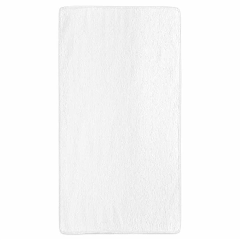 May include: A white plush throw blanket. The blanket is soft and fluffy, perfect for cuddling up on the couch.