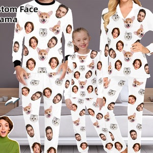 May include: A family wearing matching pajamas with custom faces printed on them. The pajamas are white with a variety of faces and animals printed on them. The text "Custom Face Pajama" is visible in the top left corner of the image.