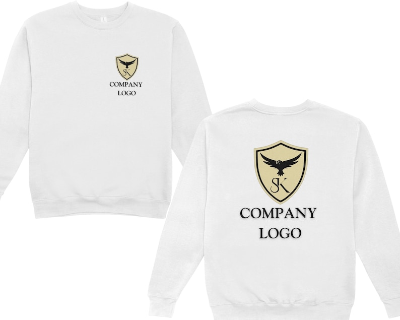 May include: White sweatshirt with a black and gold company logo on the front and back. The logo features a shield with a bird inside and the letters "SK". The text "COMPANY LOGO" is printed below the logo.