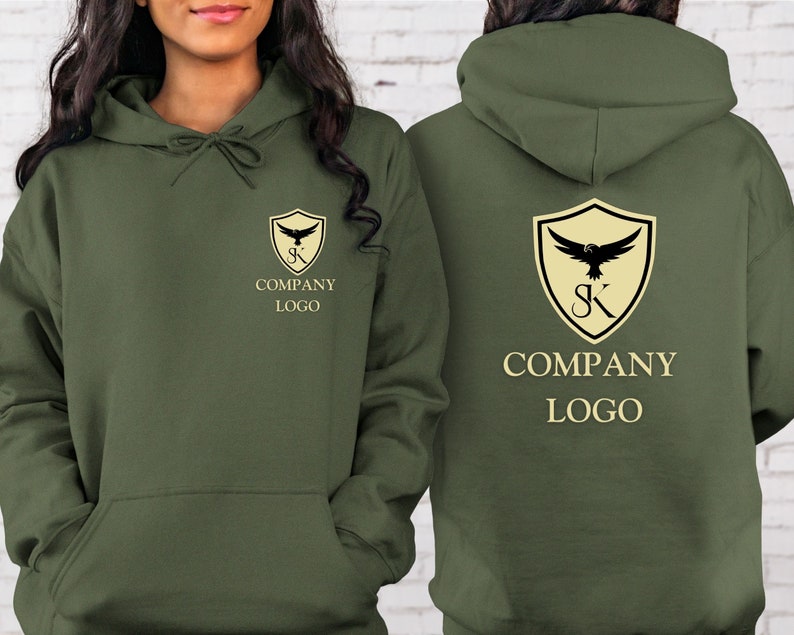 May include: Two olive green hoodies with a company logo featuring a shield with a bird and the letters "SK" inside. The text "COMPANY LOGO" is printed below the shield.