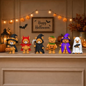 May include: Six small teddy bear figurines dressed in Halloween costumes, including a witch, devil, grim reaper, pumpkin, wizard, and ghost. They stand in a row, each holding a seasonal accessory like a pumpkin bucket or broomstick.