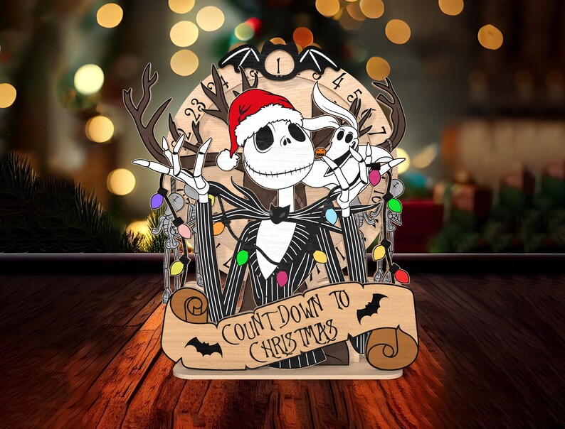 May include: A wooden Christmas countdown ornament featuring Jack Skellington from The Nightmare Before Christmas wearing a Santa hat and holding a reindeer antler. The ornament has a circular countdown clock with the text "Count Down to Christmas" on a banner.