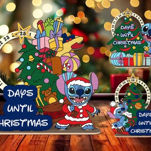 May include: Three wooden Christmas countdown ornaments featuring a blue cartoon character. Each ornament has a circular countdown with numbers and the text "Days Until Christmas".