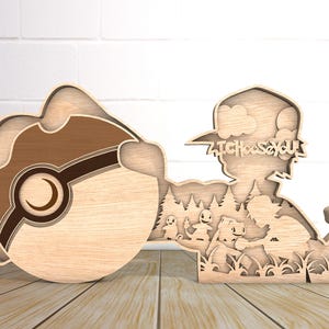 May include: Wooden cutout of a Pokemon character with a Pokeball. The character is wearing a hat with the text "I Choose You" on it. The character is standing in a forest with other Pokemon characters.