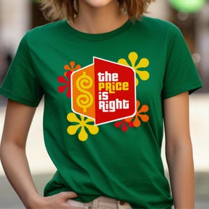 May include: Green t-shirt with a red, yellow, and orange graphic of the "Price is Right" logo with a dollar sign and flowers.
