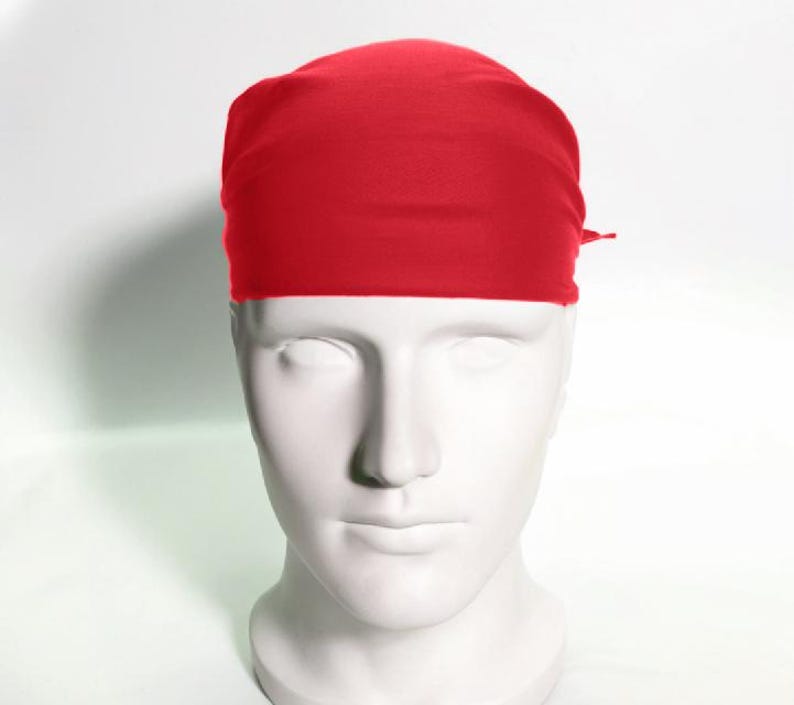 May include: A solid red bandana, folded and tied around a mannequin's head.