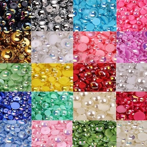 Könnte beinhalten: Sortiment aus 12 verschiedenen Farben runder, irisierender Kunststoffverzierungen. Die Farben umfassen Schwarz, Silber, Weiß, Gold, Hellgrün, Gelb, Rot, Elfenbein, Blau, Türkis, Rosa und Grün.