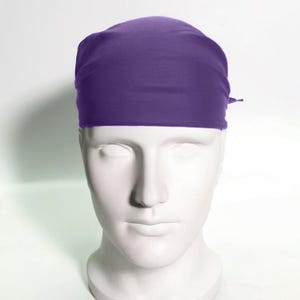 May include: A solid purple bandana, folded and tied around a mannequin's head.