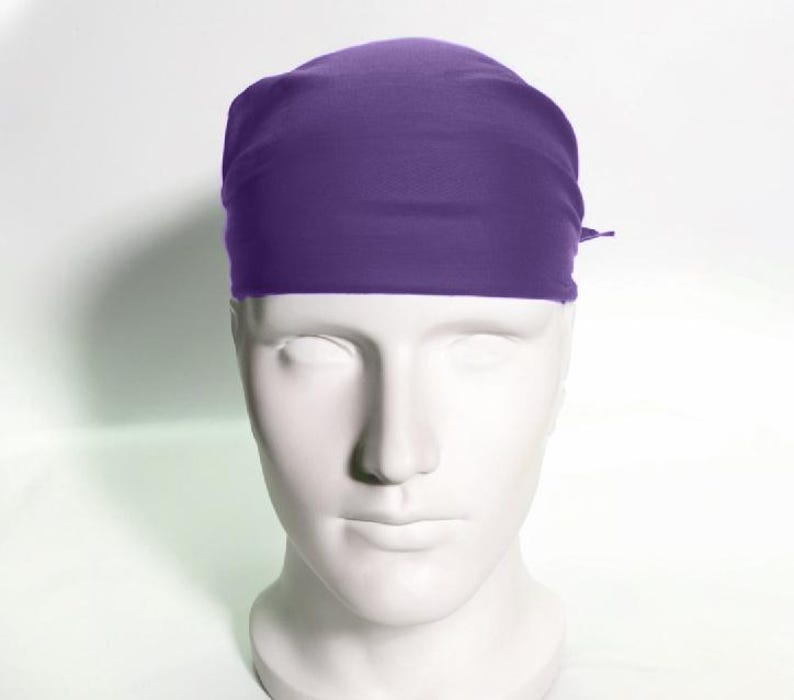 May include: A solid purple bandana, folded and tied around a mannequin's head.