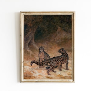 May include: A vintage oil painting depicting two leopards in a dark forest setting. The leopards are brown and black with spots, and they are positioned in a natural pose. The painting is framed in a simple, light wood frame.