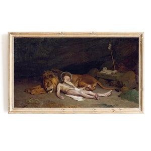 May include: A painting depicting a scene from the Bible, showing a man lying down next to a lion. The man is wearing a halo and the lion is lying down with its head resting on the man's leg. The painting is set in a dark cave with a rocky background.