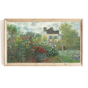 May include: A painting depicting a garden with a house in the background. The garden is filled with colourful flowers, including red, yellow, and white. The house is white with a brown roof and has a few windows. The painting is framed in a light wood frame.