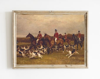 Könnte beinhalten: Ein Vintage-Ölgemälde, das eine Gruppe von Jägern zu Pferd zeigt, die mit einer Meute Hunde durch ein Feld reiten. Die Jäger sind in traditionellen roten Jagdjacken und schwarzen Hüten gekleidet. Das Gemälde ist vor dem Hintergrund eines bewölkten Himmels und sanfter Hügel gemalt.
