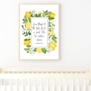 May include: A framed print with a white background and a lemon wreath border. The print features the text "Give thanks to the Lord, for he is good; His love endures forever. 1 Chronicles 17:16".