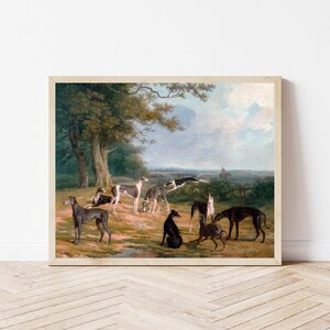 May include: A painting of a group of greyhounds in a wooded landscape. The dogs are in various poses, some running, some standing, and some lying down. The background is a lush green forest with a blue sky and white clouds.
