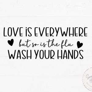 May include: Black and white typography sign with the text "LOVE IS EVERYWHERE but so is the flu WASH YOUR HANDS" with two black hearts on either side of the text.